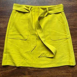 LOFT mustard yellow miniskirt with deep front pockets and tie belt